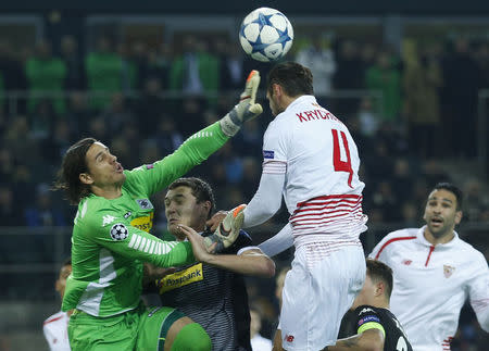 Football Soccer - Borussia Moenchengladbach v Sevilla - UEFA Champions League Group Stage - Group D - Borussia-Park, Moenchengladbach, Germany - 25/11/15 Borussia Moenchengladbach's goalkeeper Yann Sommer and Sevilla's Grzegorz Krychowiak in action REUTERS/Ina Fassbender