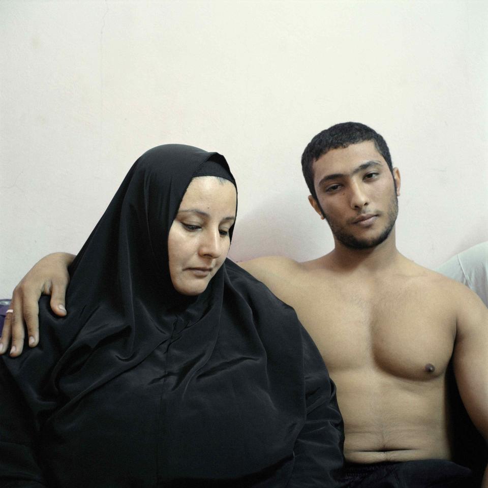 Denis Dailleux, a French photographer working for Agence Vu, won the 2nd Prize in the People - Stage Portraits Stories category for his series of pictures which include this one Ali, a young Egyptian bodybuilder, posing with his mother in Cairo February 3, 2011. REUTERS/Denis Dailleux/World Press Photo Handout via Reuters