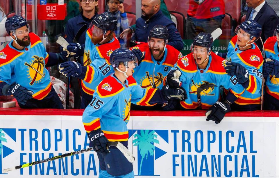 Florida Panthers center Anton Lundell (15) celebrate with the bench after scoring scores a goal during shootout of an NHL game against Calgary Flames at FLA Live Arena on Saturday, November 19, 2022 in Sunrise, Fl.