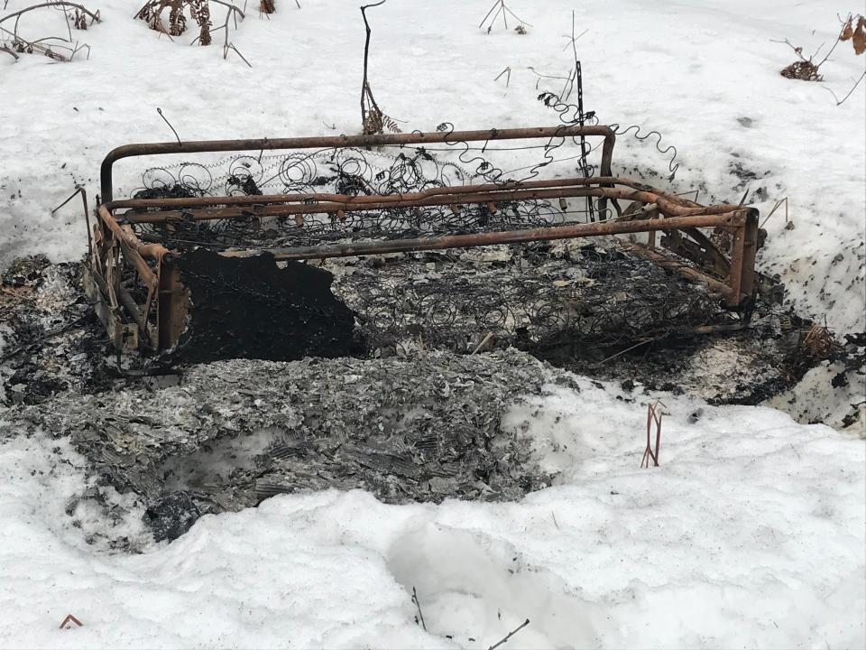 While taking her dog for a walk on Alpena State Road last winter, Karen Martin found a fold up, roll away bed that had been dumped and burned just off the roadway.