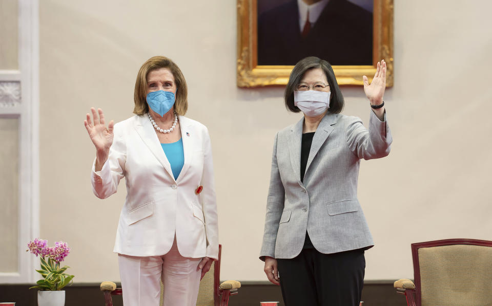 FILE - In this photo released by the Taiwan Presidential Office, U.S. House Speaker Nancy Pelosi, left, and Taiwanese President President Tsai Ing-wen wave during a meeting in Taipei, Taiwan, Wednesday, Aug. 3, 2022. The U.S. government has announced talks with Taiwan, Thursday, Aug. 18, 2022, on a trade treaty in a new sign of support for the self-ruled island democracy claimed by China’s ruling Communist Party as part of its territory. The announcement comes after Beijing launched military drills in an attempt to intimidate the island after Pelosi's visit. (Taiwan Presidential Office via AP, File)