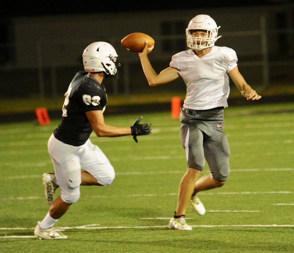 Hawley's Rodey Hooper throws a pass under pressure.