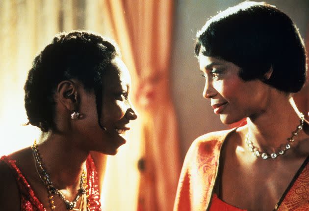Whoopi Goldberg smiles with Margaret Avery in a scene from the film 