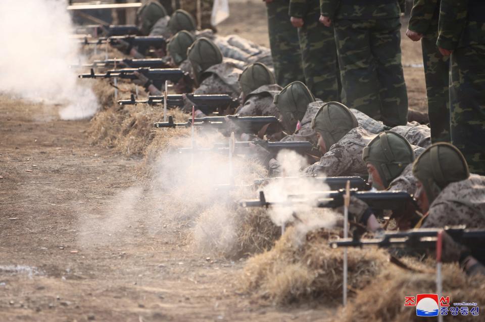 Soldiers participate in a demonstration during the training of the Korean People's Army's air and amphibious combat units.