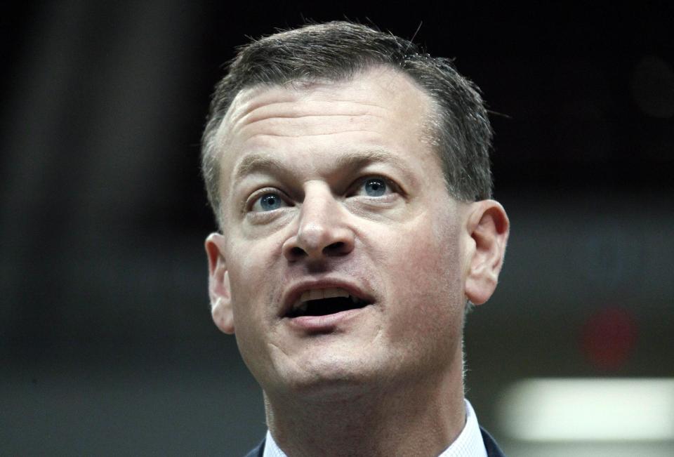 In this photo taken April 2, 2012, Mississippi State athletic director Scott Stricklin speaks during a news conference in Starkville, Miss. Stricklin said he understands why there are raised eyebrows at the amount of money floating around college football. The Bulldogs are right in the middle of the cash grab as part of the behemoth Southeastern Conference _ recently announcing a $75 million expansion of Davis Wade Stadium that will push its capacity to 61,337 seats (AP Photo/Rogelio V. Solis)
