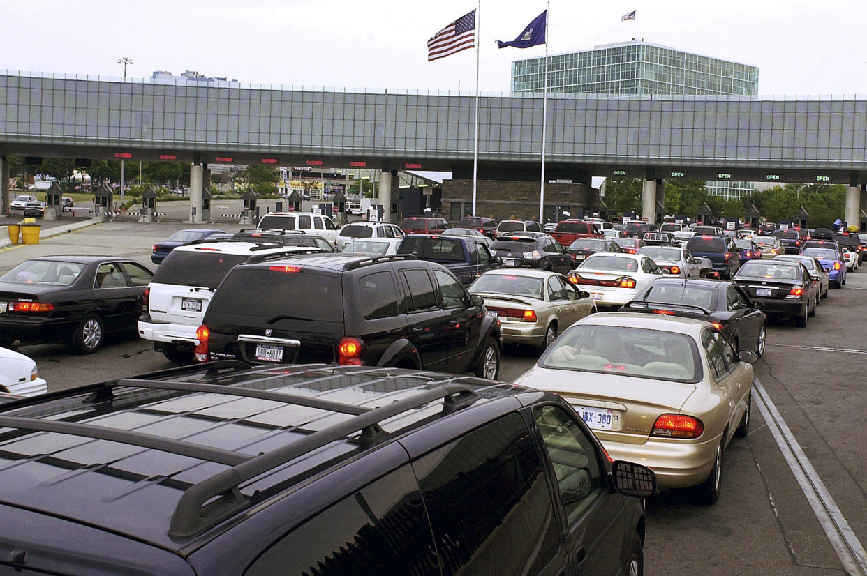 FILE - In this Aug. 4, 2005 file photo, traffic traveling from Niagara Falls, Ontario, Canada, lines up on the Rainbow Bridge to enter the United States through a border checkpoint at Niagara Falls, N.Y. Some along the northern U.S. border are worried the temporary transfer of hundreds of border agents south could cause backups of those seeking to enter the United States from Canada during the busy 2019 summer tourist season. (AP Photo/Don Heupel, File)