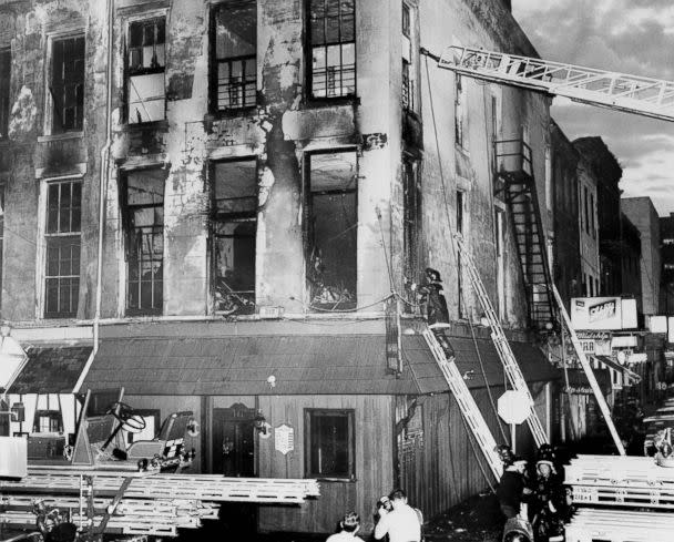 PHOTO: A firefighter examines the remains of the UpStairs Lounge on June 24, 1973, after a fire that left 32 dead. (New Orleans Times-Picayune via AP)