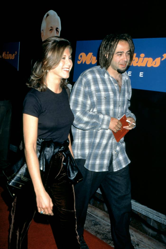 American actress Jennifer Aniston and American musician Adam Duritz attend the "Mr. Jenkins Soiree" at the Ace Gallery Los Angeles on September 29, 1995 in Los Angeles, California