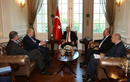 Turkish Prime Minister Binali Yildirim (C) meets with British Foreign Secretary Boris Johnson (2nd L) in Ankara, Turkey, September 27, 2016. Hakan Goktepe/Prime Minister's Press Office/Handout via REUTERS