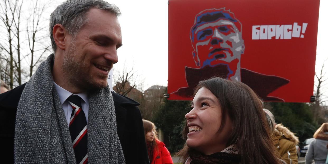 Prague's mayor Zdenek Hrib and Zhanna Nemtsova, the daughter of Russian opposition figure Boris Nemtsov smile after unveiling a sign renaming the square where the Russian embassy is located in Prague on February 27.