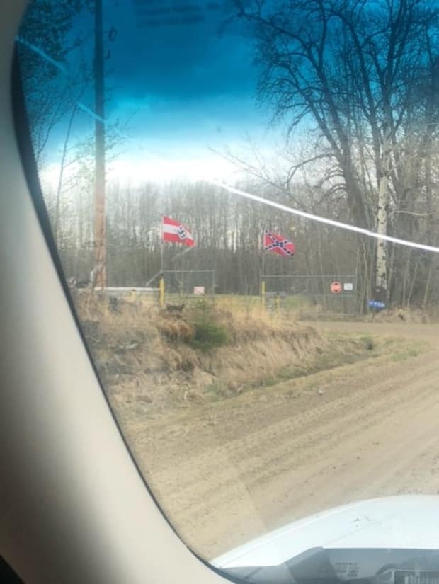 Hitler Youth and Confederate flags fly on a property outside Breton in Brazeau County, Alta.  (Friends of Simon Wiesenthal Center - image credit)