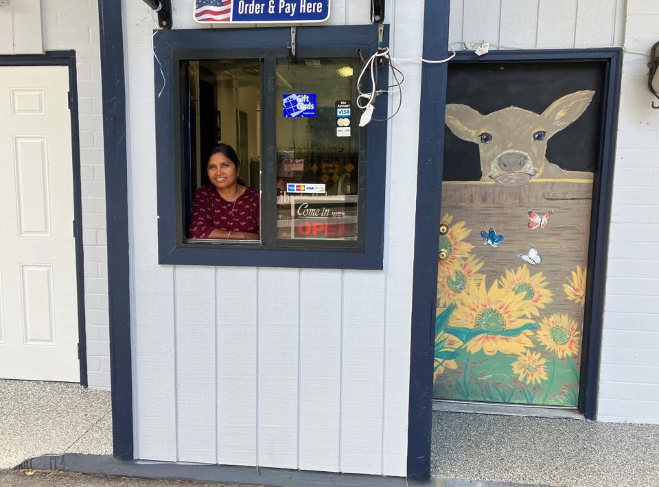 Subhashini Golla is the founder, owner and cook at newly opened Corner Farm Kitchen, a stand-alone, drive-thru bakery and sandwich shop at 6661 Bowden Road. The neighboring hand-painted portrait of a happy dairy cow reflects the building's founding as a Skinner Dairy store.