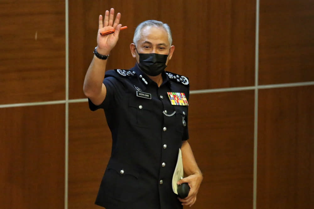 Inspector-General of Police Datuk Seri Acryl Sani Abdullah waves to the media at a press conference in Bukit Aman, May 31, 2021. — Picture by Choo Choy May