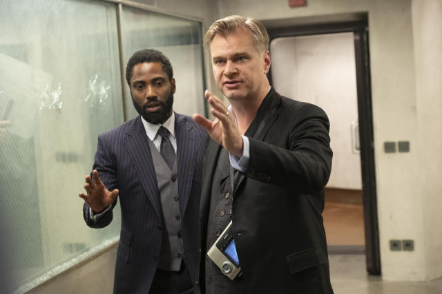 (L-r) JOHN DAVID WASHINGTON and director/writer/producer CHRISTOPHER NOLAN on the set of Warner Bros. Pictures’ action epic &quot;TENET,&quot; a Warner Bros. Pictures release.  (Warner Bros.)