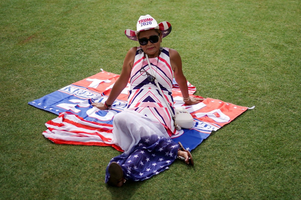 Trump supporters gathered at the former president’s golf club in Miami ahead of the rally on Tuesday evening (REUTERS)