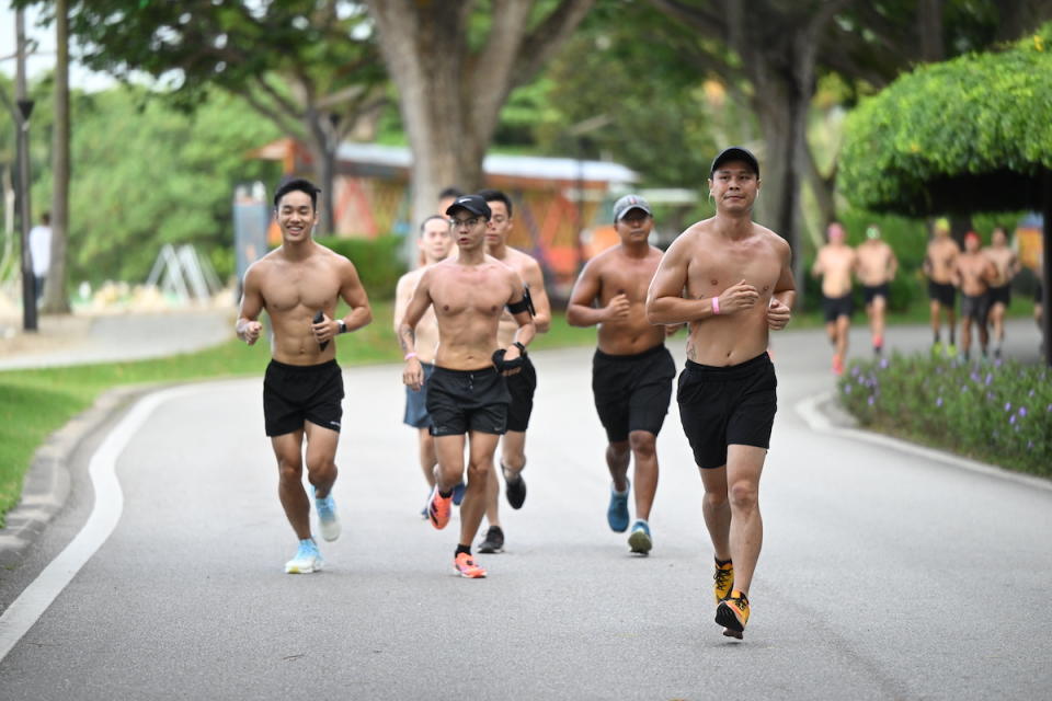 Participants running without their tops in the 