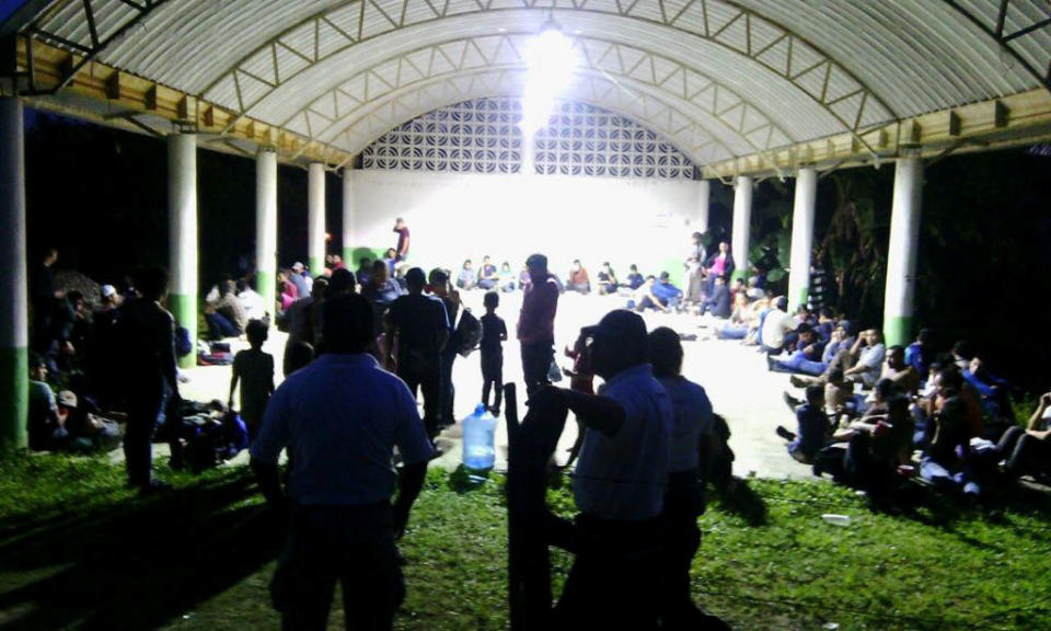 Central Americans are seen in the town of Tantima, Mexico, after Mexican authorities said that they rescued 147 Central Americans abandoned in the wilderness of Veracruz state after alleged human smugglers forced them off the cramped tractor trailer they were traveling in on their way to the United States, in this handout photograph released by the Mexican National Institute of Migration on July 30, 2017. National Institute of Migration/Handout via REUTERS. ATTENTION EDITORS - THIS IMAGE HAS BEEN SUPPLIED BY A THIRD PARTY.