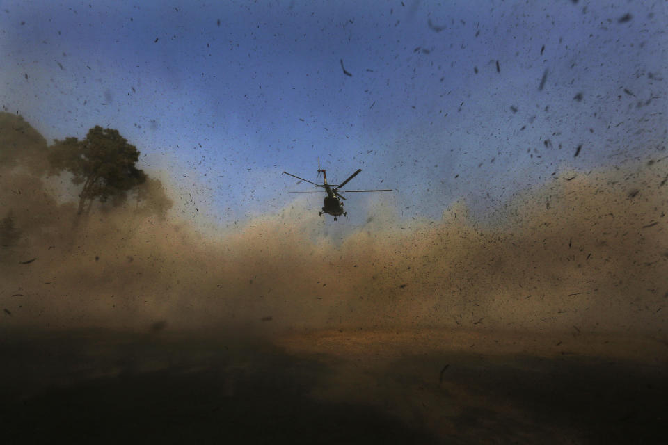 A helicopter carrying bodies of victims of a plane crash arrives in Kathmandu, Nepal, Tuesday, Jan. 17, 2023. Nepalese authorities on Tuesday began returning to families the bodies of victims of a flight that crashed Sunday, and said they were sending the aircraft's data recorder to France for analysis as they try to determine what caused the country's deadliest plane accident in 30 years. (AP Photo/Bikram Rai)