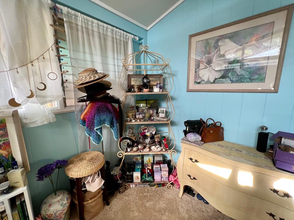 a corner of my room with a shelf and dresser