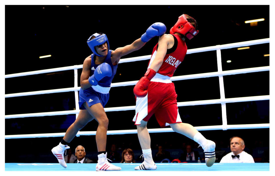 <p>Boxing uniforms are also pretty in the middle, but the added headgear and, of course, gloves add another layer of dress to the sport.</p><p><i>(Photo: Getty Images)</i><br></p><p><br></p>