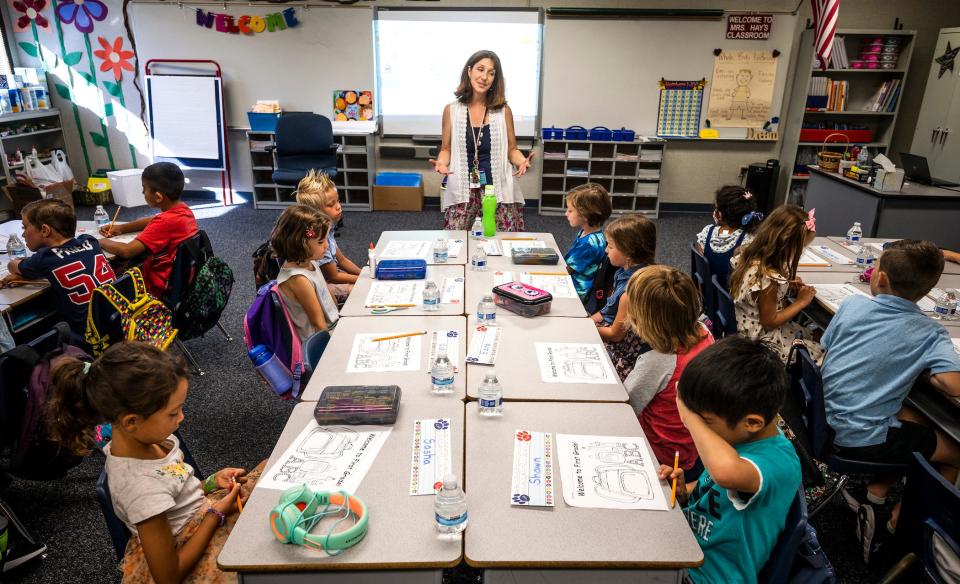 Teacher Christine Hay talks to her students on the first day of class at Melinda Heights Elementary School in Rancho Santa Margarita, California, Monday, August 15, 2022.