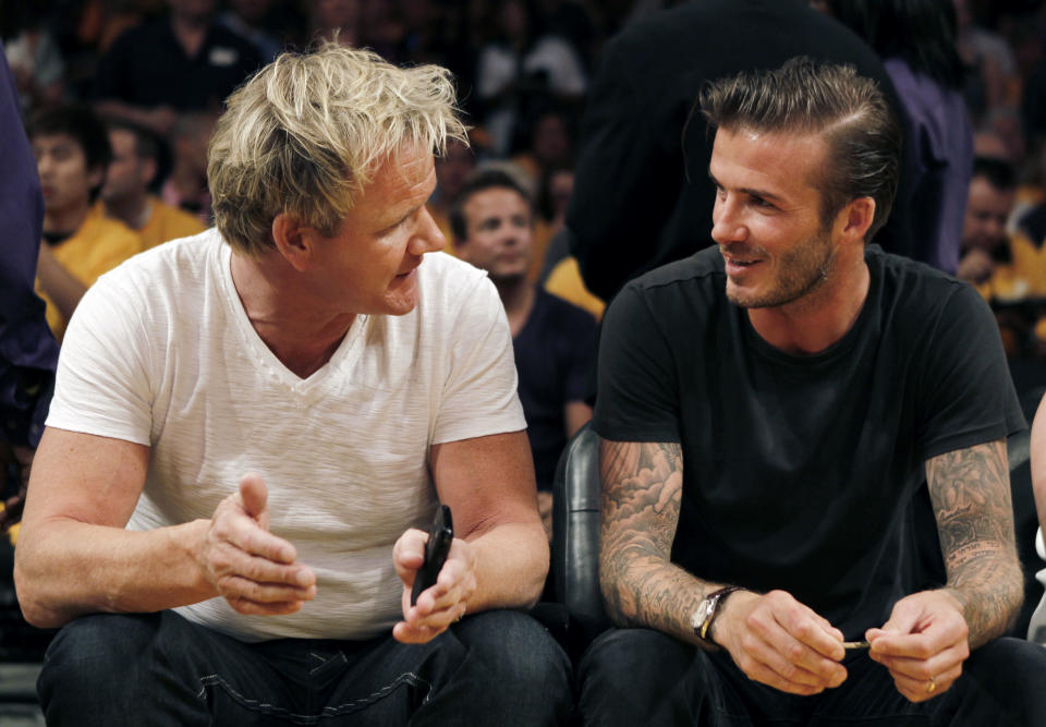 Chef Gordon Ramsay, left, and David Beckham are seen talking before Game 1 of the Los Angeles Lakers and Dallas Mavericks second-round NBA playoff basketball series Monday, May 2, 2011, in Los Angeles. (AP Photo/Matt Sayles)