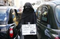 A London cab driver wears a Star Wars themed costume during a protest against Uber on Whitehall in central London, Britain February 10, 2016. REUTERS/Stefan Wermuth