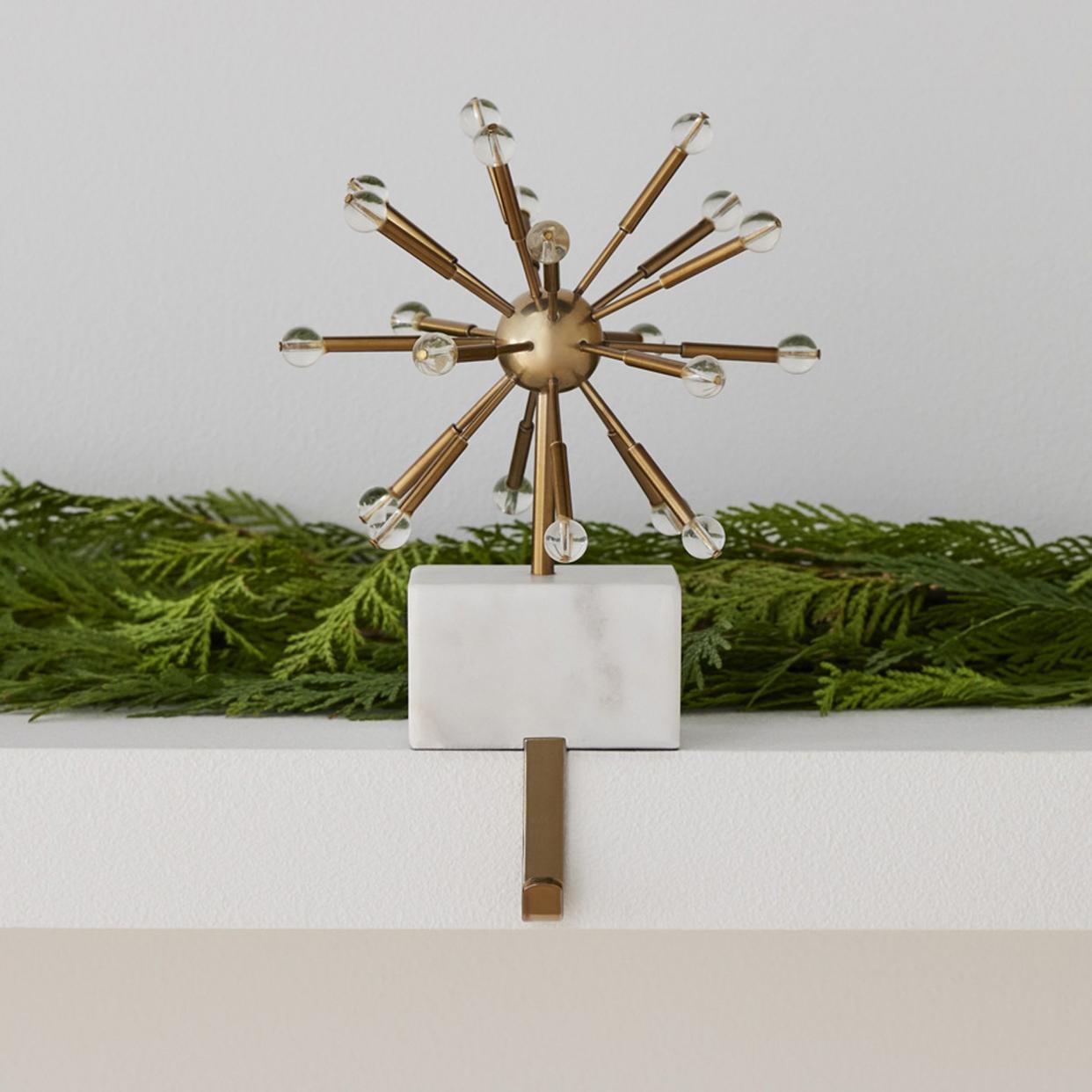 <p><a href="https://go.redirectingat.com?id=74968X1596630&url=https%3A%2F%2Fwww.westelm.com%2Fproducts%2Fsputnik-marble-brass-stocking-holder-d5516&sref=https%3A%2F%2Fwww.housebeautiful.com%2Fshopping%2Fhome-accessories%2Fg41902567%2Fmid-century-modern-christmas-decor%2F" rel="nofollow noopener" target="_blank" data-ylk="slk:Shop Now;elm:context_link;itc:0;sec:content-canvas" class="link rapid-noclick-resp">Shop Now</a></p><p>Sputnik Marble & Brass Stocking Holder</p><p>westelm.com</p><p>$45.00</p><span class="copyright">West Elm</span>