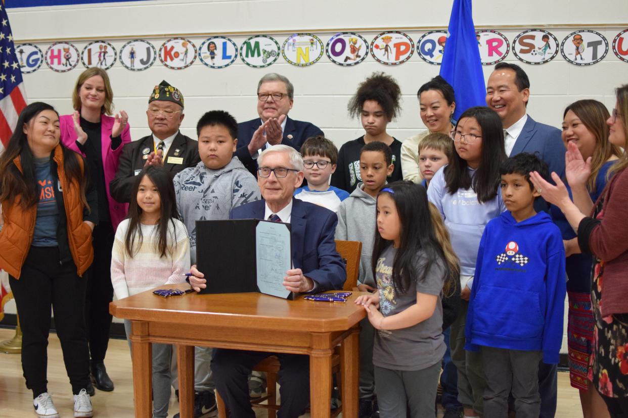 Governor Tony Evers is shown here after signing a bill requiring the teaching of Asian American and Hmong American contributions and histories in K-12 curriculum. He signed the bill at a ceremony at Jones Elementary School in Wausau April 4.
