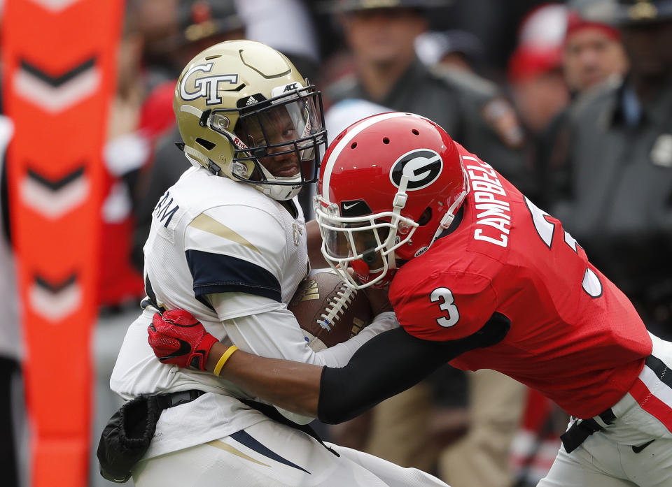 FILE - In this Saturday, Nov. 24, 2018 file photo, Georgia Tech quarterback James Graham (4) is tackled by Georgia defensive back Tyson Campbell (3) after a catch in the second half an NCAA college football game in Athens, Ga. Daniel Jeremiah noted that Georgia teammates Tyson Campbell and Eric Stokes plus Florida State’s Asante Samuel Jr. as cornerbacks who could still be available early in the second round. The Packers could use some cornerback help and also would like to boost their depth on both sides of the line of scrimmage. (AP Photo/John Bazemore, File)