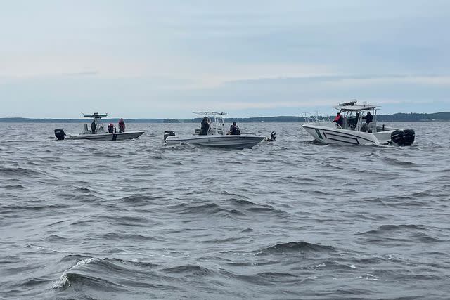 <p>Sabine Parish Sheriff's Office</p> Authorities on Toledo Bend Lake in Louisiana after a boat capsized, leaving two people dead