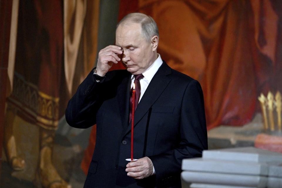 Russian President Vladimir Putin attends the Orthodox Easter service at the Cathedral of Christ the Saviour in Moscow, Russia, Sunday, May 5, 2024. (Pavel Bednyakov, Sputnik, Kremlin Pool Photo via AP)