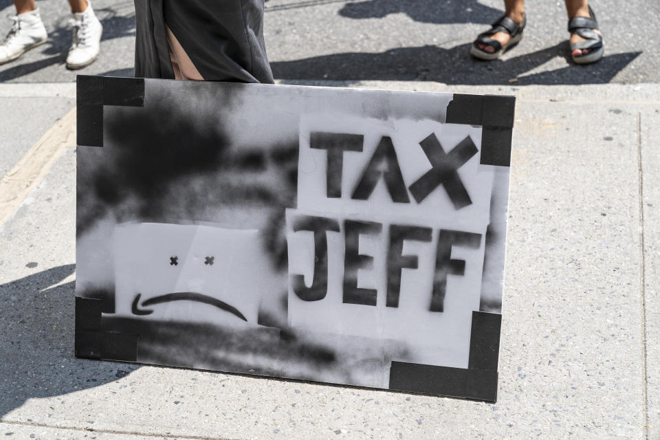 Few dozens of protesters gather in front of Jaff Bezos residency on 5th Avenue in Manhattan in New York on August 9, 2020. Protesters demand to tax rich people and in particular CEO of Amazon Jeff Bezos. (Photo by Lev Radin/Sipa USA)