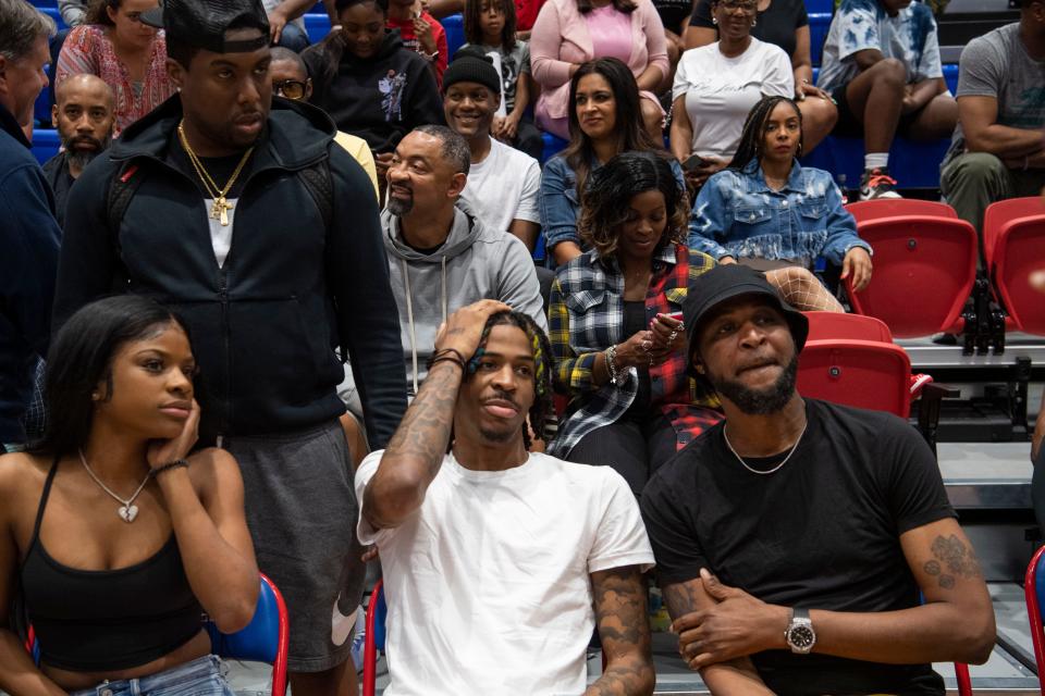Teniya Morant, Ja Morant and Tee Morant watch from the stands during the annual Iverson Classic All-Star game at Bartlett High School  in Bartlett , Tenn., Saturday, April 30, 2022.