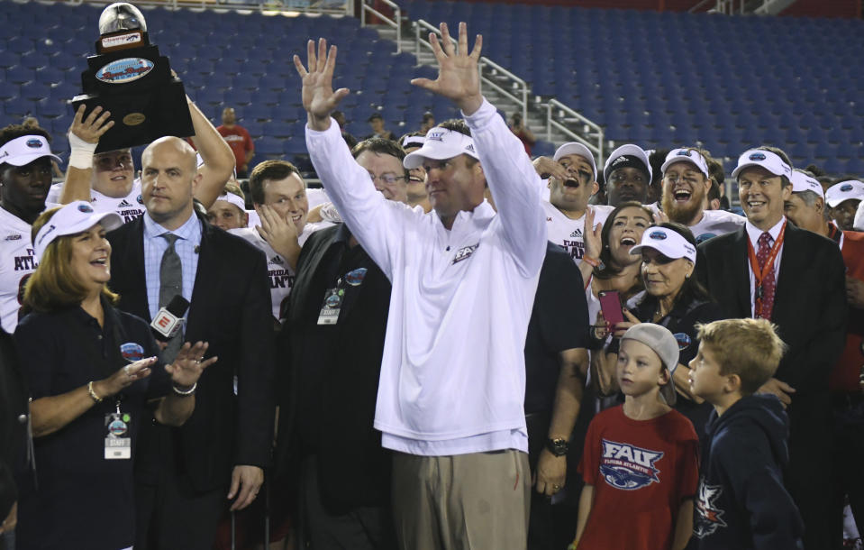 Florida Atlantic Owls head coach Lane Kiffin holds up 10 fingers as fans shout “ten more years” following a 50-3 victory over Akron in Boca Raton, Fla., on Tuesday. (Jim Rassol/South Florida Sun-Sentinel via AP)