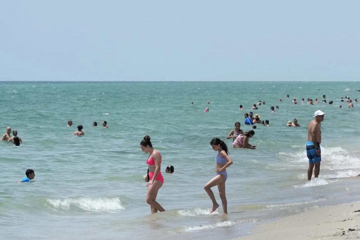 Visitors in Hollywood Beach try to cool off in the Atlantic last week, when the water temperature was in the mid-90s.