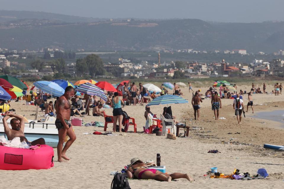 People spend time on the beach in Lebanon's port city of Tyre.