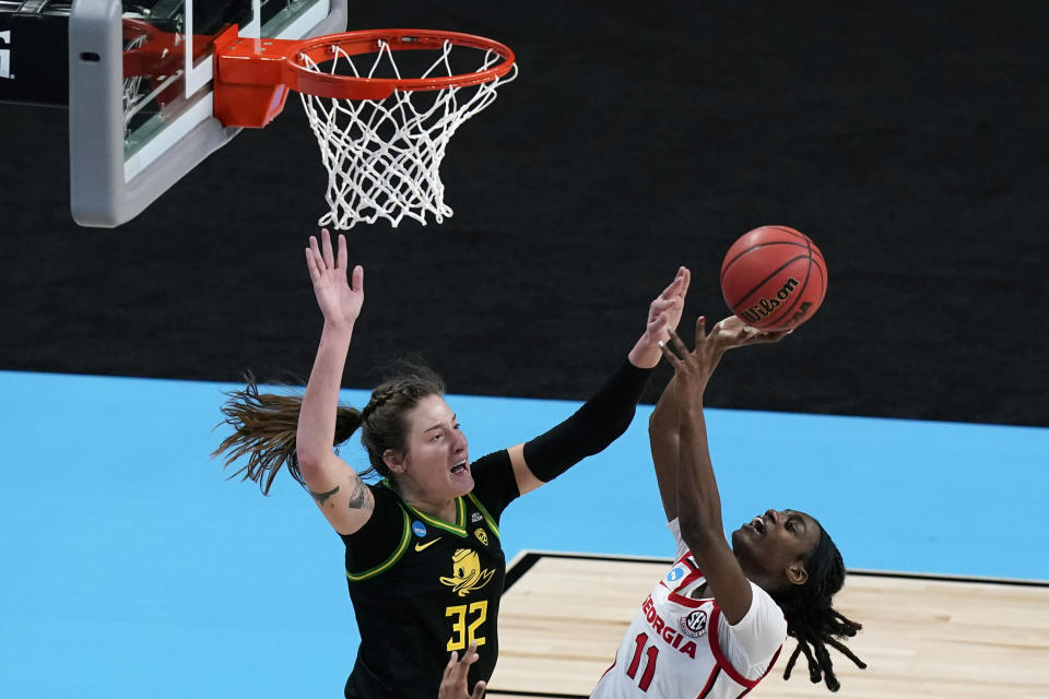 Oregon forward Sedona Prince (32) tries to block a shot by Georgia guard Maya Caldwell (11) during the second half of a college basketball game in the second round of the women's NCAA tournament at the Alamodome in San Antonio, Wednesday, March 24, 2021. Oregon won 57-50. (AP Photo/Eric Gay)