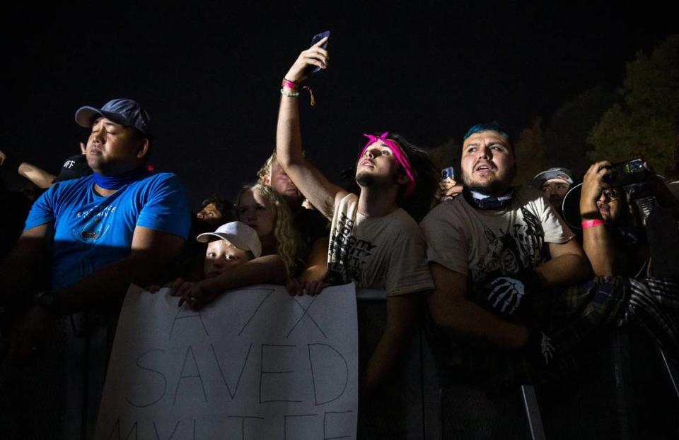 Fans stand in the front row as Avenged Sevenfold performs on the first day of Aftershock music festival on Thursday.