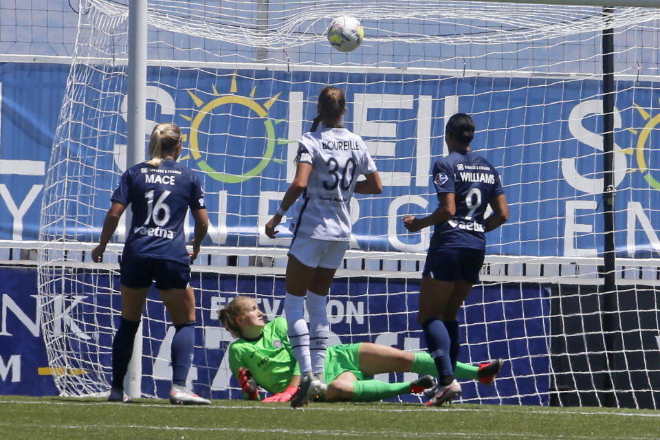 Portland Thorns FC goalkeeper Bella Bixby looks on as North Carolina Courage forward Lynn Williams (9) scores against her during the second half of an NWSL Challenge Cup soccer match at Zions Bank Stadium Saturday, June 27, 2020, in Herriman, Utah. (AP Photo/Rick Bowmer)