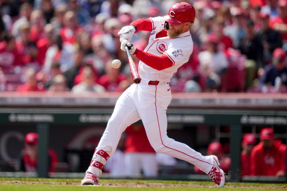 Cincinnati Reds right fielder Jake Fraley (27) hits a single in the second inning of a baseball game against the Washington Nationals, Sunday, March 31, 2024, at Great American Ball Park in Cincinnati.