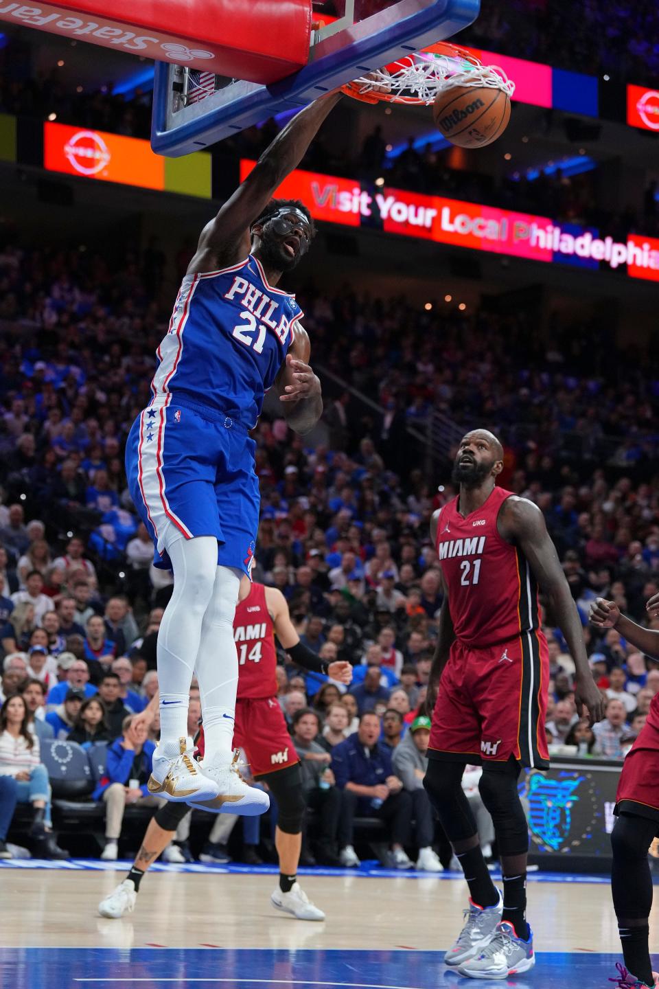 Joel Embiid throws down the one-handed slam during the first half of Game 3.