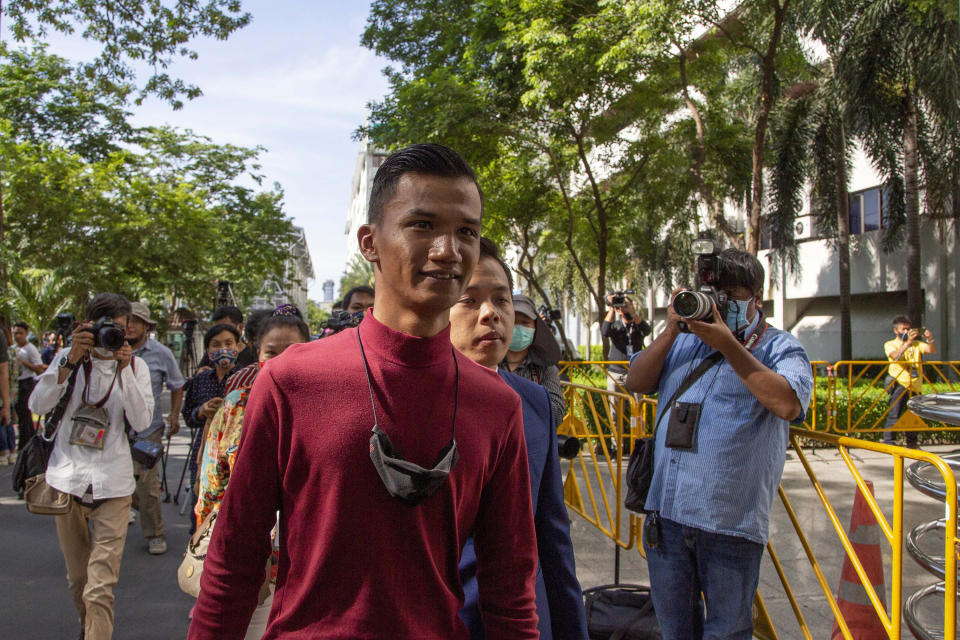 FILE- In this Sept. 3, 2020, file photo, pro-democracy activist Panupong Jadnok, also known as Mike Rayong, front, arrives at criminal courthouse for hearing to determine whether he has violated his bail conditions in Bangkok, Thailand. Jadnok and Arnon Nampha, two top leaders of Thailand's pro-democracy protest movement, were released from jail Monday, Sept. 7, 2020 after police agreed they no longer needed to be detained for investigation. (AP Photo/Gemunu Amarasinghe, File)