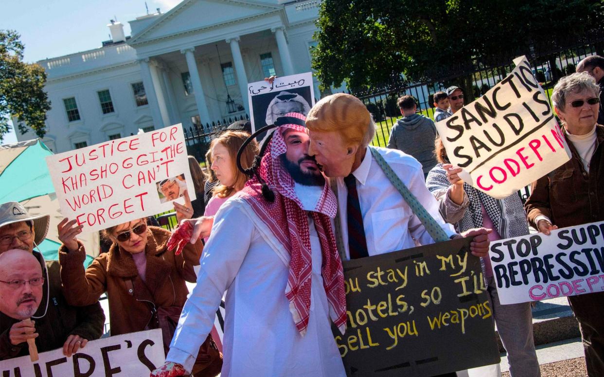 Protesters at the White House accused Donald Trump and the Saudis of engaging in a cover up - AFP