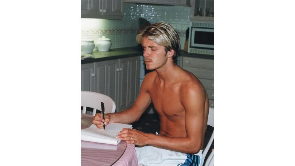 David Beckham writing his wedding vows at kitchen table