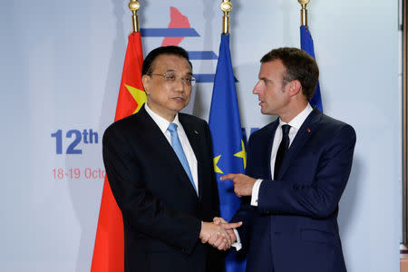 French President Emmanuel Macron meets with Chinese Prime Minister, Li Keqiang, before ASEM leaders summit in Brussels, Belgium October 18, 2018. Aris Oikonomou/Pool via REUTERS