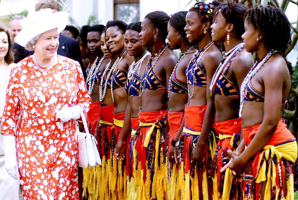 <p>The Queen is welcomed by traditional Mozambican dancers at the Polana Hotel, Maputo, Mozambique, during a state visit to Africa. (PA) </p>