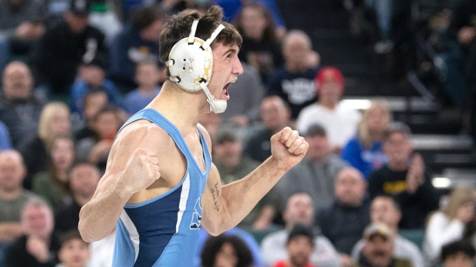 St. Augustine's Richie Grungo celebrates after pinning Christian Brothers Academy's Julian George during a 144 lb. semifinal round bout of the NJSIAA individual wrestling championships tournament at Jim Whelan Boardwalk Hall in Atlantic City on Friday, March 3, 2023.   