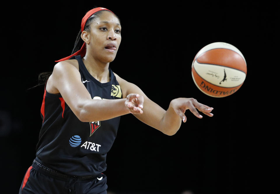 Las Vegas Aces' A'ja Wilson passes against the Washington Mystics during the first half of Game 4 of a WNBA playoff basketball series Tuesday, Sept. 24, 2019, in Las Vegas. (AP Photo/John Locher)