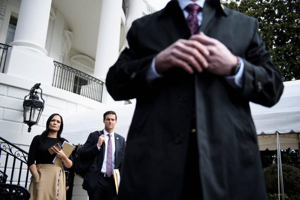 White House Press Secretary Stephanie Grisham and Trump aid John McEntee II listen as US President Donald Trump speaks to the press while walking to Marine One on the South Lawn of the White House February 7, 2020, in Washington, DC.